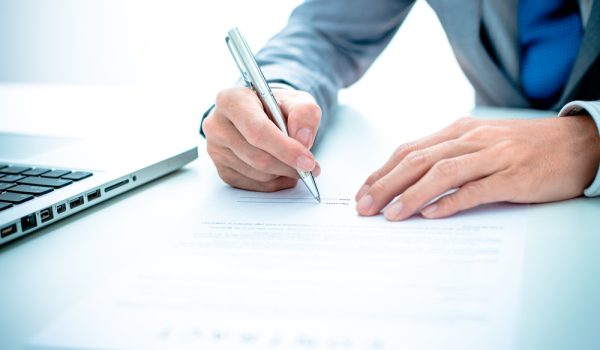 Business man signing a contract